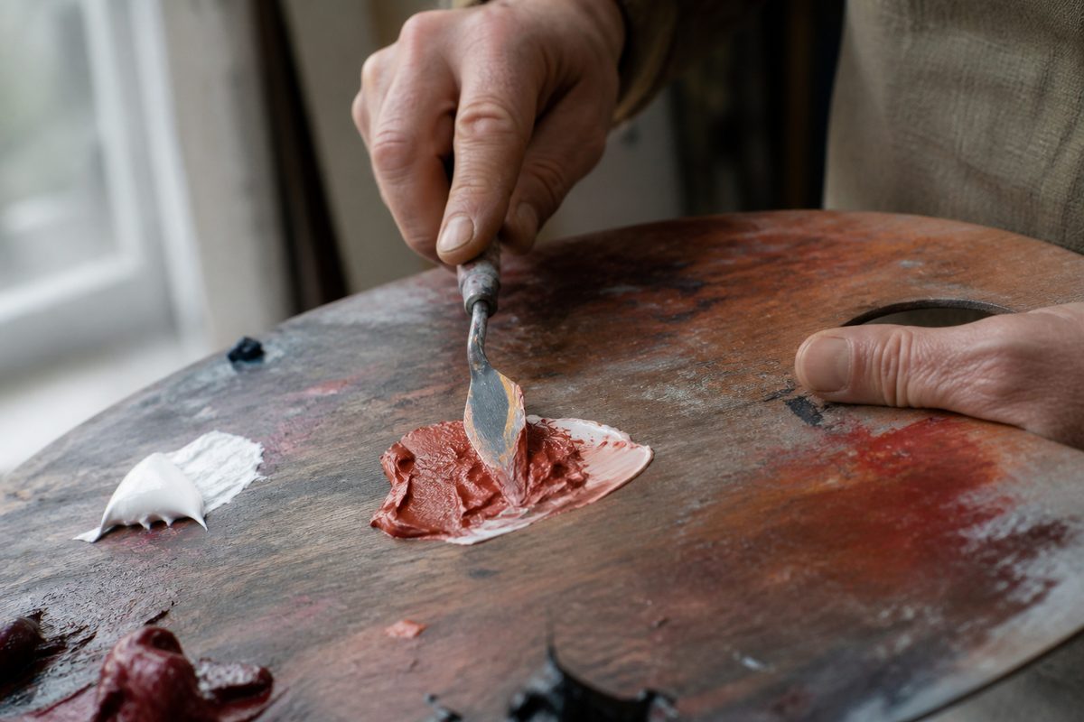 Wooden palette with oil paints and palette knife